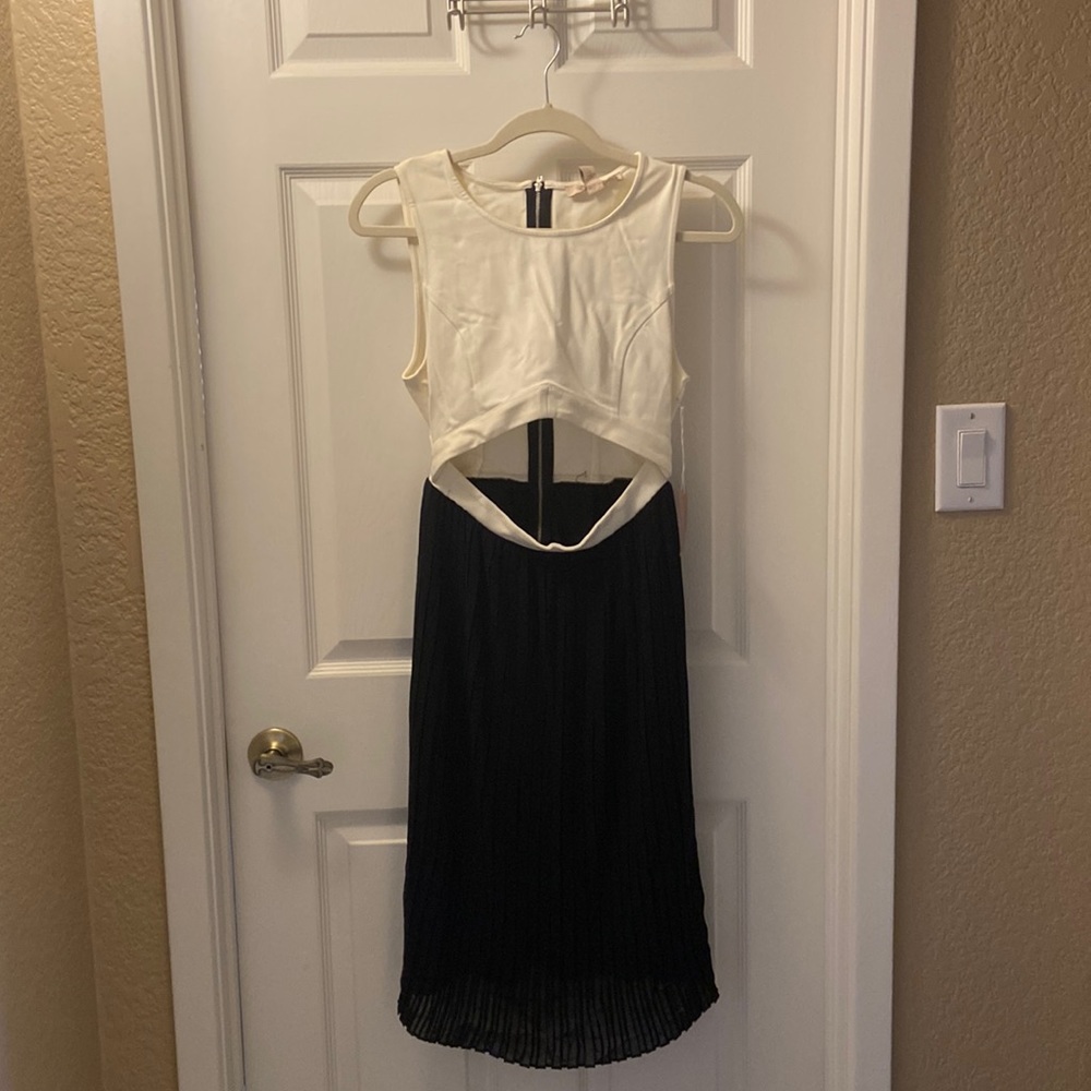 Dress. Forever 21. Never Worn. Pleated bottom. Cutout. Sleeveless.